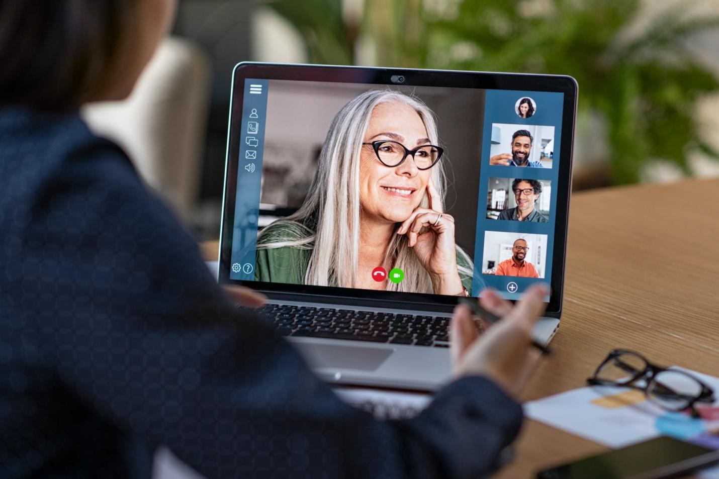 A group of people looking at a computerDescription automatically generated